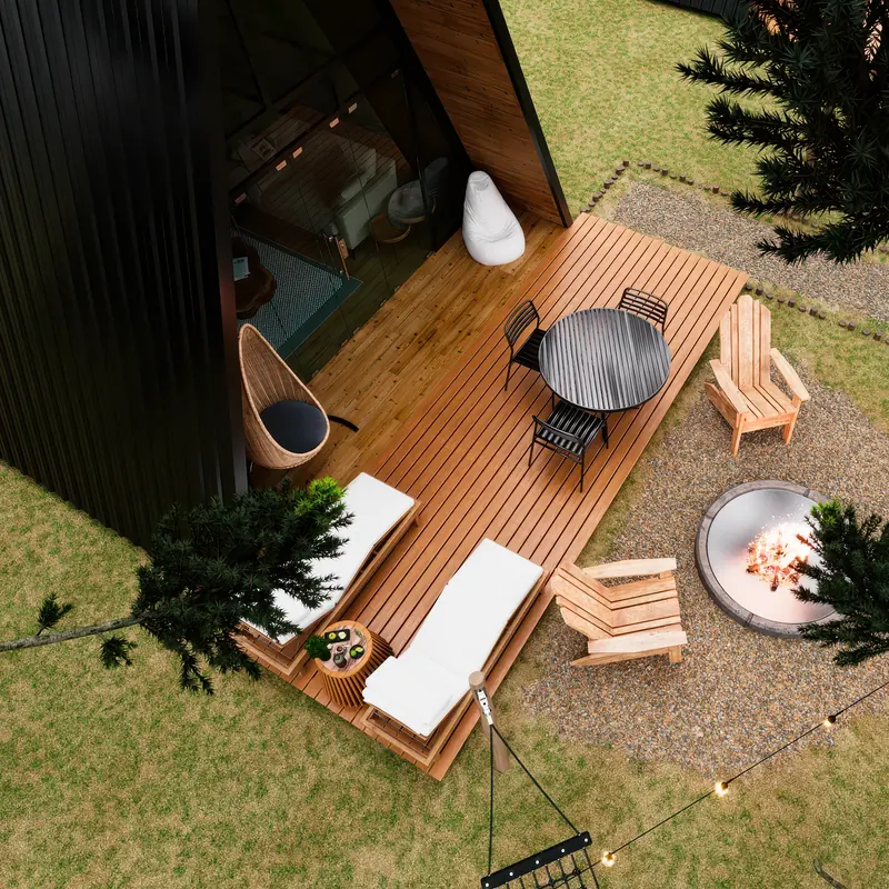 Deck de madeira com mesa, espreguiçadeiras e fire pit, visto de cima.